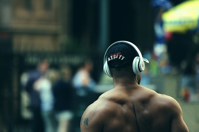 bodybuilder wearing headphones
